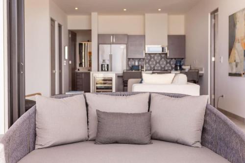 a living room with a couch and a bedroom at Boutique Ocean Escape with Relaxing Amenities in El Pescadero