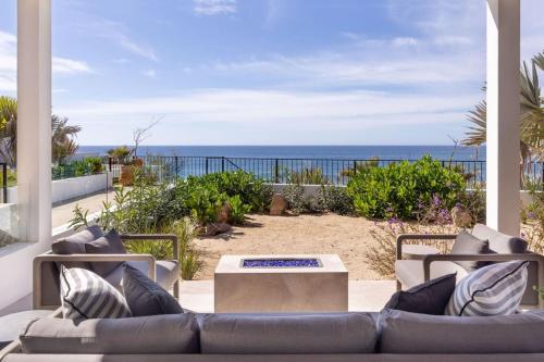 a patio with a couch and a view of the ocean at Boutique Ocean Escape with Relaxing Amenities in El Pescadero