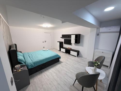 En eller flere senge i et værelse på WPP Apartament