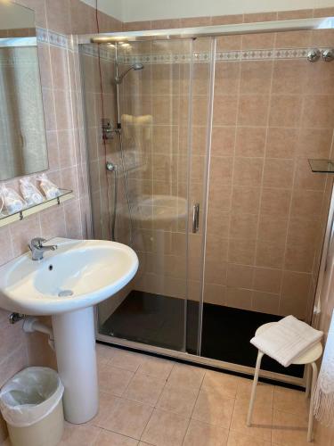 a bathroom with a shower and a sink at Hotel Morandi in Sanremo
