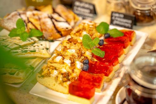 a plate of food on a table with food at Great Polonia Dwarf Wrocław in Wrocław