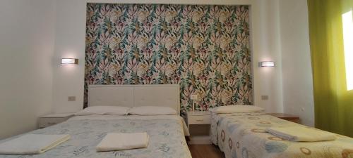 Letto o letti in una camera di The Caponi Bros