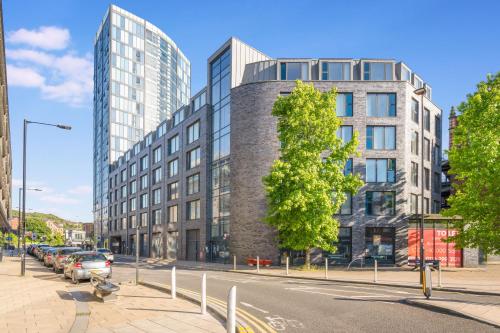 a building on a street with cars parked in front of it at Stay Angels - Blonk Street Sheffield Luxury Apartments in Sheffield