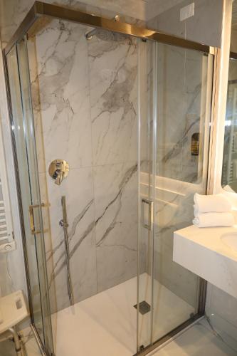 a shower with a glass door in a bathroom at Hotel Ristorante Continental in Osio Sotto