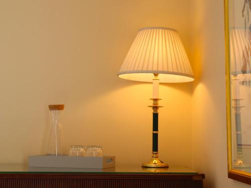 a lamp sitting on top of a table at Mains of Orton in Fochabers