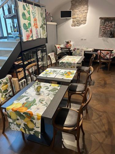 a room with two tables and chairs in a store at Bed and Breakfast Casa Mosole in Malcesine