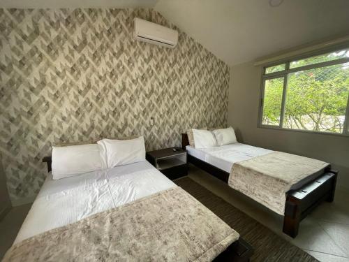 Ένα ή περισσότερα κρεβάτια σε δωμάτιο στο Hotel Campestre Palma Verde