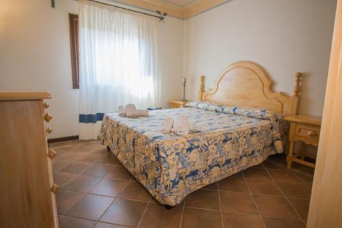 Ένα ή περισσότερα κρεβάτια σε δωμάτιο στο Porto Cervo Apartments Wifi And Ac