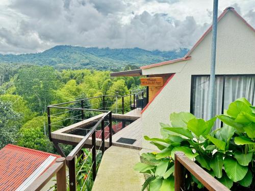 a stairway leading to a building with mountains in the background at Pachakuti Eco-vida Hotel in Caicedonia