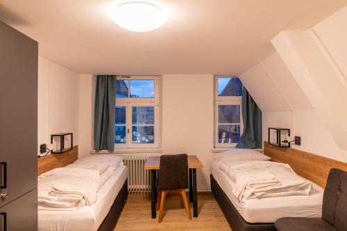 Postel nebo postele na pokoji v ubytování Brauhaus-Hotel König von Flandern