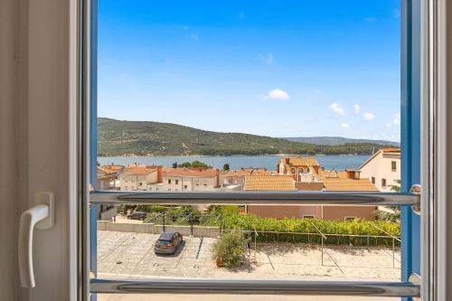 a view of a city from a window at Apartments Jana & Paula in Cres