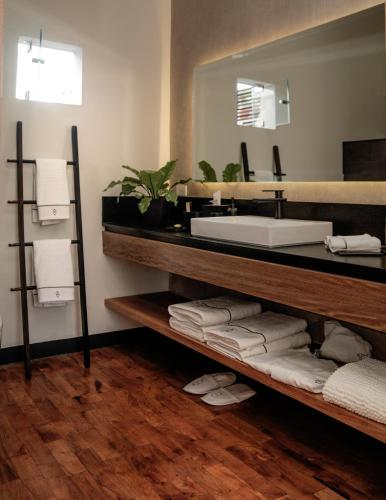 a bathroom with a sink and a mirror at Casa No Name Small Luxury Hotel in San Miguel de Allende