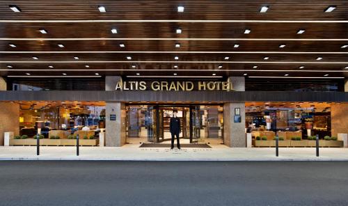 an atiths grand hotel with a sign in front of it at Altis Grand Hotel in Lisbon