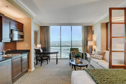 a hotel room with a kitchen and a living room at Classic Suite MGM Signature 25th FLR POOL VIEW in Las Vegas