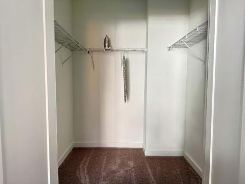 an empty room with white walls and a closet at Luxury New 1B1B Private Balcony w Dryer Washer 525Pkwy211 in Atlanta