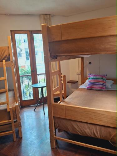 Postel nebo postele na pokoji v ubytování Temazcal Hostel