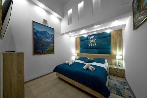 Aparthotel Giewontにあるベッド