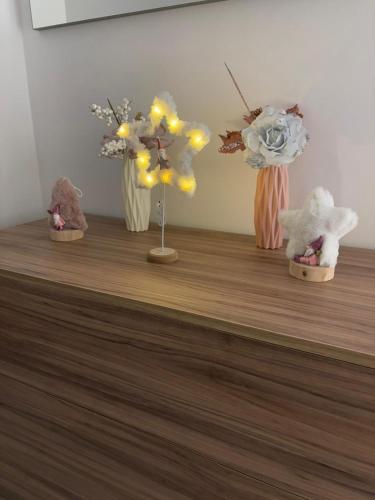 a group of vases with flowers on a counter at San Vito Apartment in Palo del Colle