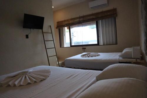 Postel nebo postele na pokoji v ubytování 3B Wellness Hotel & Hostel Adults Only