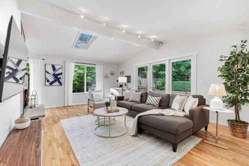 a living room with a couch and a table at Mid-Century Modern Home - 3-Bedroom Rambler in Kirkland