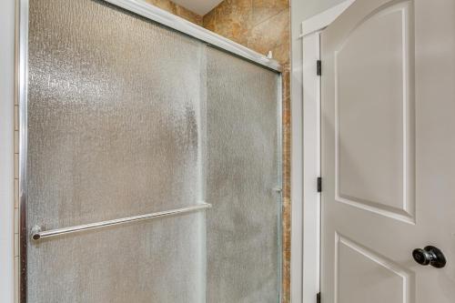 a shower with a glass door in a bathroom at Eugene Area Home 18 Mi to U of O! in Junction City