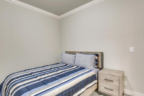 a bedroom with a bed and a night stand at Eugene Area Home 18 Mi to U of O! in Junction City