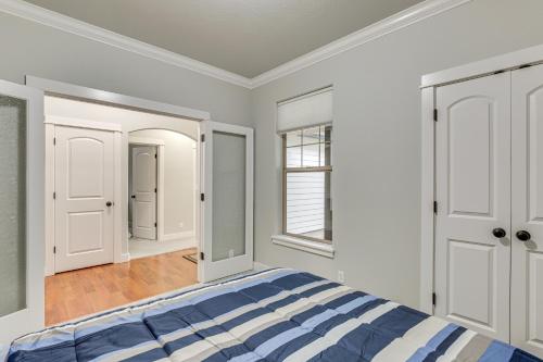 a bedroom with a bed and a mirror at Eugene Area Home 18 Mi to U of O! in Junction City