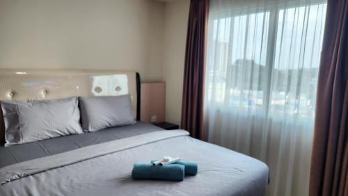 Ένα ή περισσότερα κρεβάτια σε δωμάτιο στο SleepRest @ Nagoya Mansion