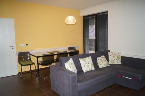 a living room with a couch and a table at Apartments Klinovec in Loučná pod Klínovcem