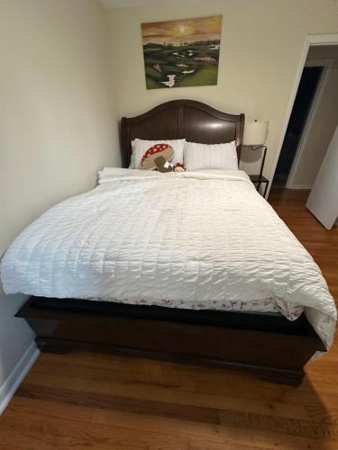 a bedroom with a large bed with a white comforter at Charming 3 Bedroom in Athens with WiFi and AC in Athens