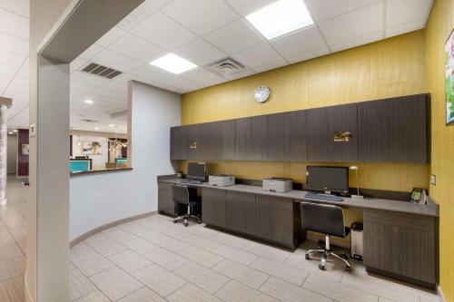 an office with two desks and two monitors at Best Western Plus Ruston Hotel in Ruston