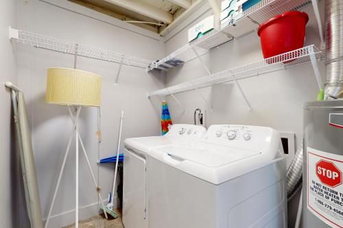 a white washer and dryer in a laundry room at Southern Sunsets in Destin