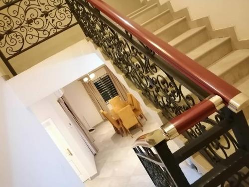 an overhead view of a staircase with a stair railing at Diaspora Holiday Villa in Aburi