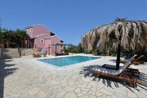 a swimming pool with an umbrella and a chair and a swimming pool at Blue Horizon in Gaios