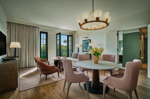 a living room with a table and chairs at Pendry Natirar in Peapack