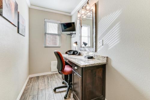 a room with a desk with a chair and a mirror at Fenced Yard Modern Barndominium in Amarillo! in Soncy