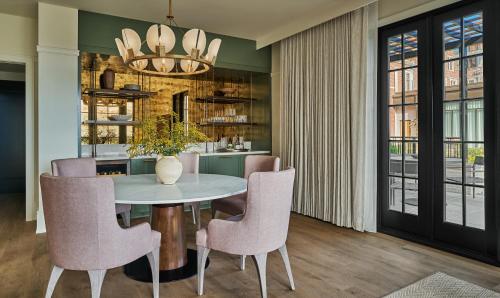 a dining room with a table and chairs at Pendry Natirar in Peapack