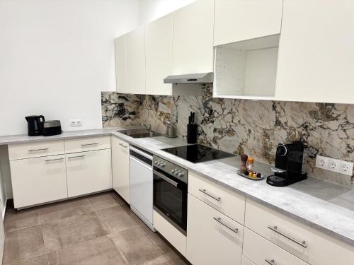 Η κουζίνα ή μικρή κουζίνα στο Elegant und Zentral - Apartment nahe Staatsoper und Altstadt