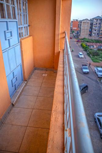 a balcony of a building with a view of a street at Cozy Haven in Juja