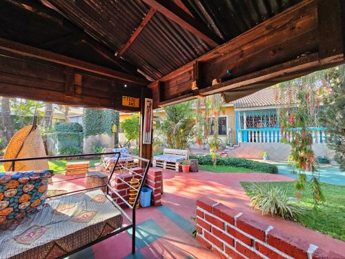 a screened in porch with a view of a yard at Mazzola Safari House & Backpacking in Arusha