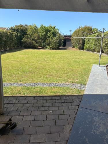 a view of a yard from a patio at Beach N Berms in Dalmeny