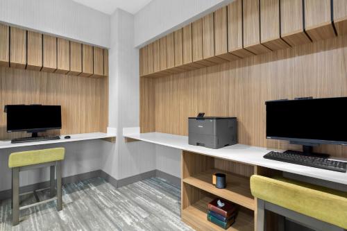 an office with a desk with a computer and a chair at Hilton Garden Inn Lexington Georgetown in Georgetown