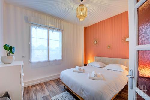 Ένα ή περισσότερα κρεβάτια σε δωμάτιο στο Appartement avec chambre proche Gare et wifi fibre