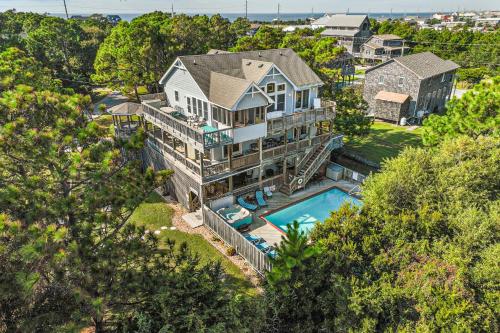 an aerial view of a house with a swimming pool at Play Time in Waves