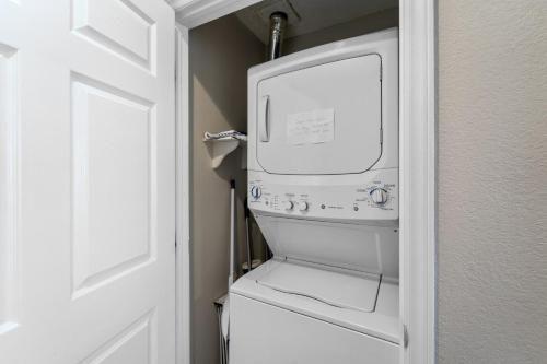 a white washer and dryer in a bathroom at Finn's Up in Hatteras
