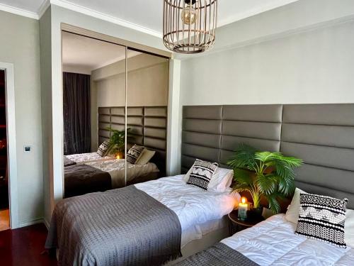 En eller flere senge i et værelse på Sunset Beach Guest House