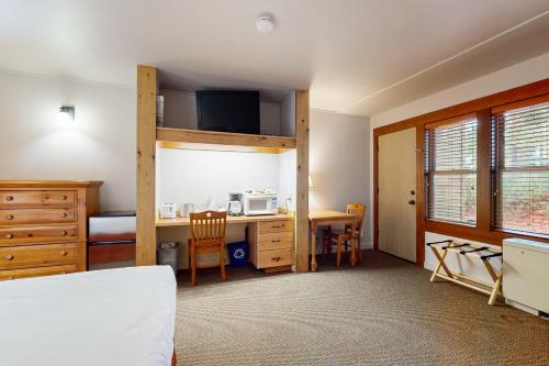 a bedroom with a bunk bed and a desk with a microwave at Seventh Mountain Resort Unit 1914 in Bend