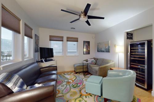 a living room with a couch and a ceiling fan at Manson Hideaway in Manson