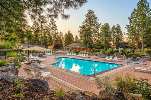 a swimming pool with lounge chairs and a resort at Seventh Mountain Resort Unit 1913 in Bend