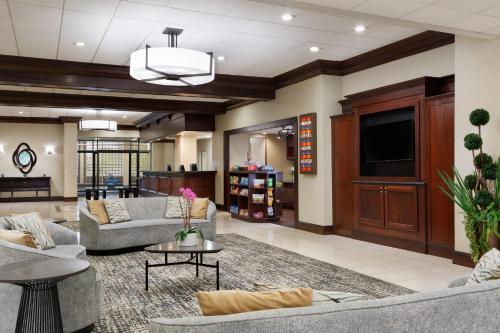 a lobby with couches and a flat screen tv at Holiday Inn National Airport/Crystal City by IHG in Arlington